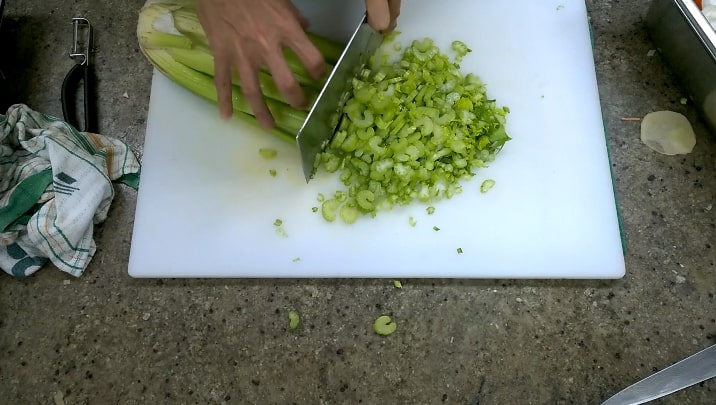 using vegetable cleaver to cut vegetables