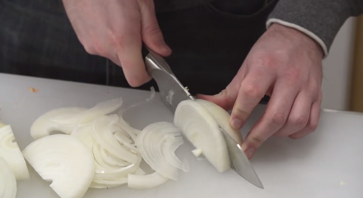 cutting vegetable with santoku knife