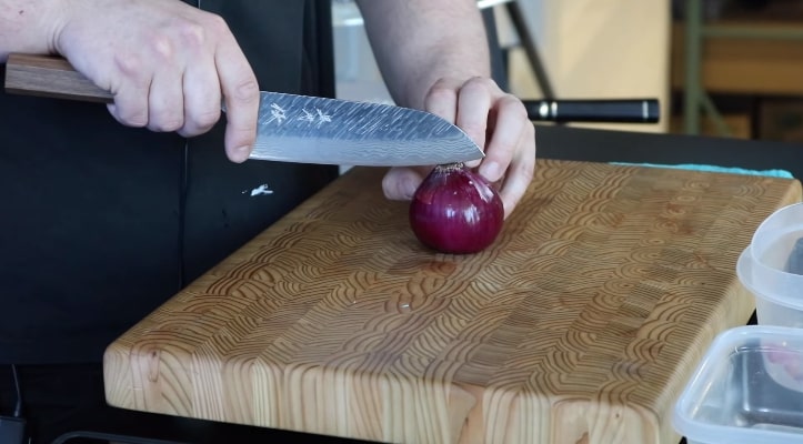 cutting onion with a santoku knife